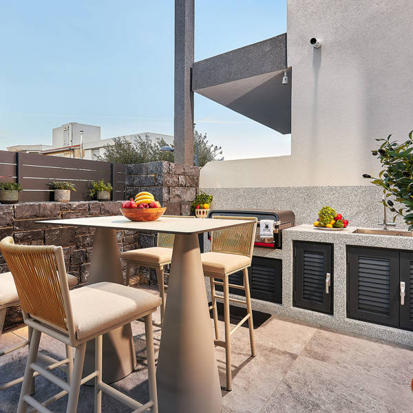 Grey Stones Villa Ammoudara BBQ area with table and the grill in the background