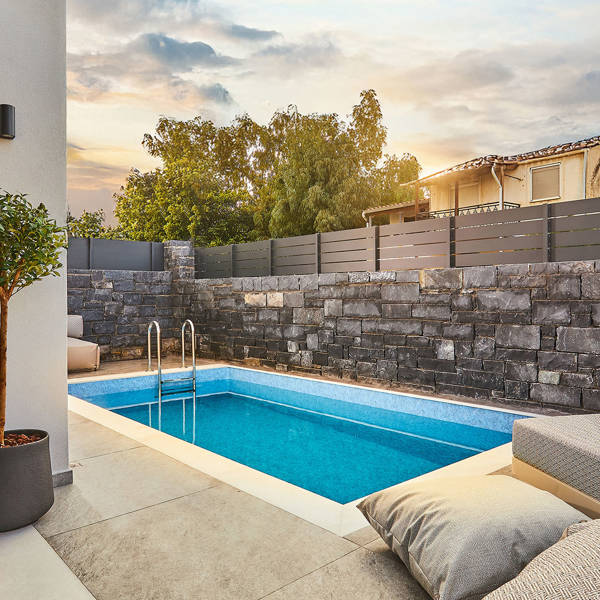 Grey Stones Villa Ammoudara room pool with sunbeds and decorations