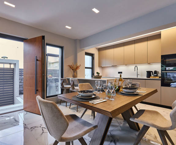 Grey Stones Villa Ammoudara room kitchen with decorated table and chairs